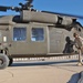 Pfc Rasheen Davis tops off a Black Hawk Helicopter.