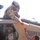 Soldiers hand out candy to Iraqi children near Baghdad