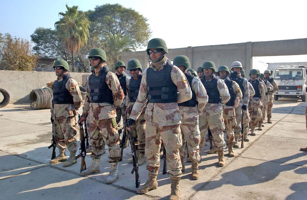 Soldiers stand in a formation at the groundbreaking ceremony