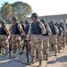 Soldiers stand in a formation at the groundbreaking ceremony