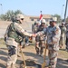 Lt. Col. James Mingo shakes hands with Col. Hayder