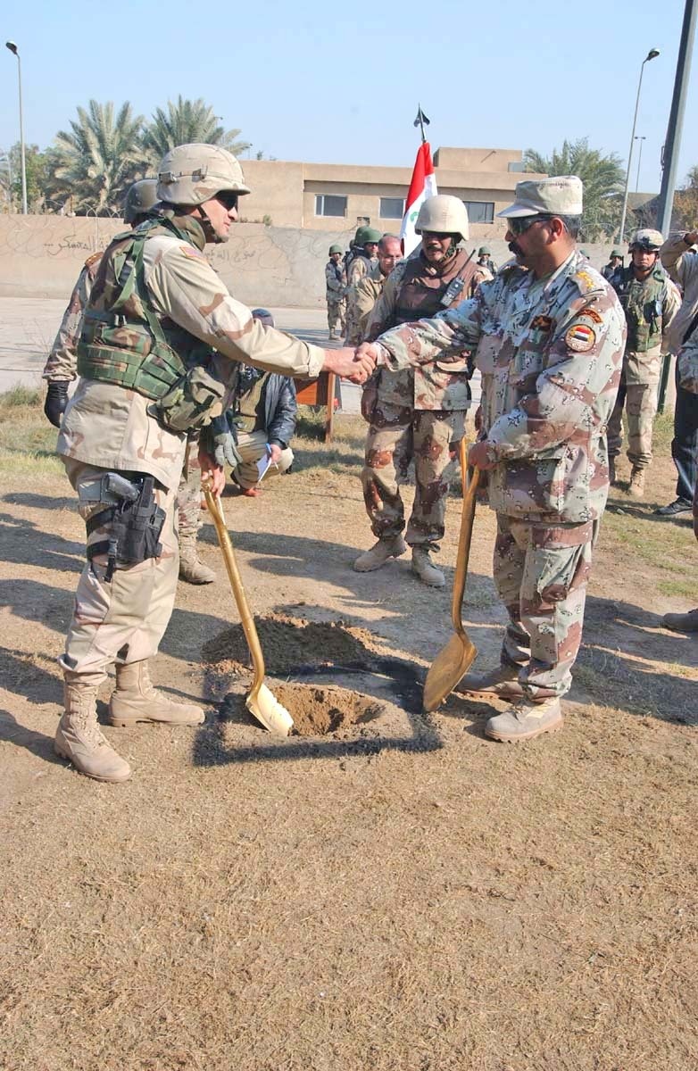 Lt. Col. James Mingo shakes hands with Col. Hayder