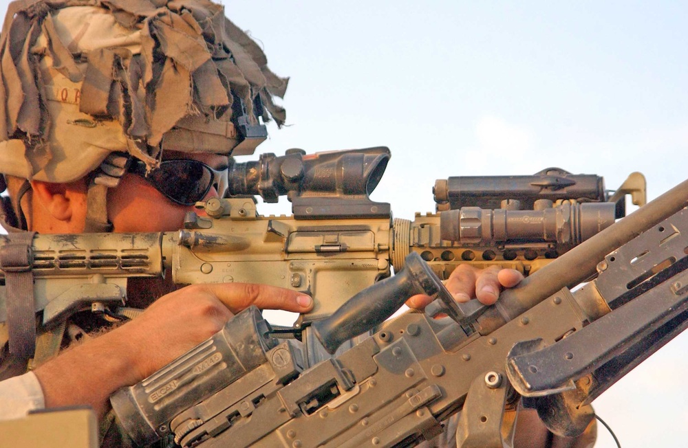 SSgt.Chris Johnson looks through his riflescope
