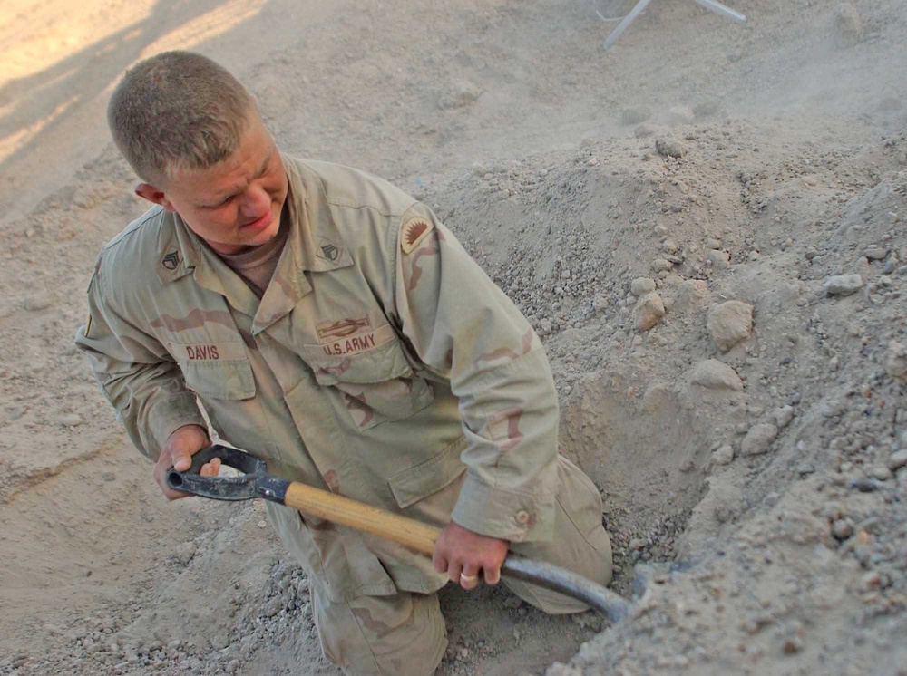 Sgt Scott Davis digs in on the north side of Fallujah