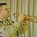 Maj. Mike Spraggins plays Taps as a final farewell