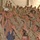 Service members reach for an autographed football thrown by Elwa