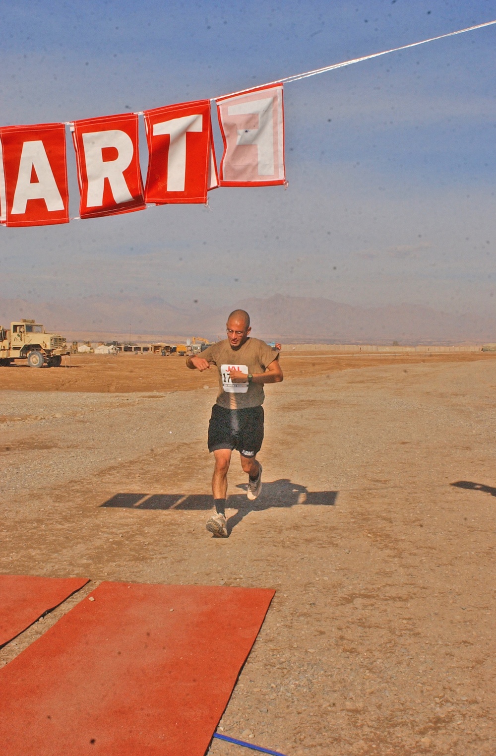 1st Lt. Mike Baskin crosses the finish line