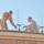 Soldiers set up a tactical satellite antenna