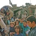 Soldiers hand out backpacks to rural Iraqi children