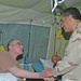 Maj. Gen. David Hicks visits with Spc. Michael A. Krasner