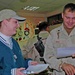 Spc. Brandon J. Dalia looks over a holiday scavenger hunt list