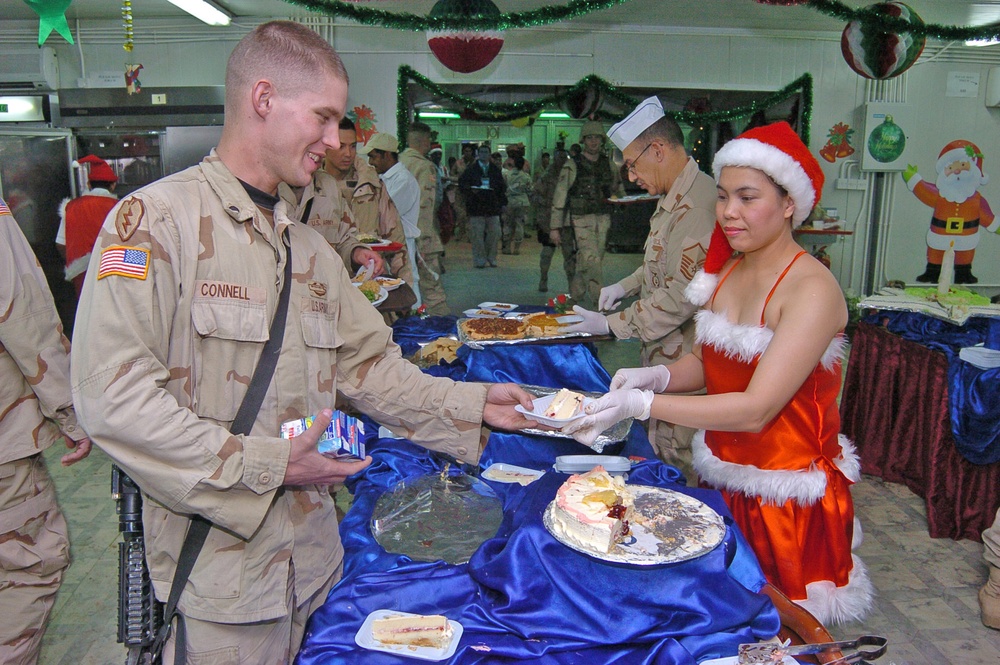 Maricel Umali a DFAC worker, serves Spc. Seth Connell
