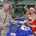 Maricel Umali a DFAC worker, serves Spc. Seth Connell