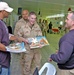 Army Spc. David Bland smiles as he receives a free 2005 Hooters