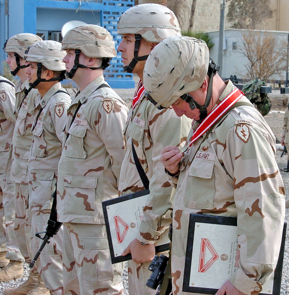 Sgt. 1st Class Timothy Hargrave looks down on his de Fleury meda