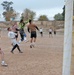 Bravo Co. and Iraqi Police players battle for a soccer ball