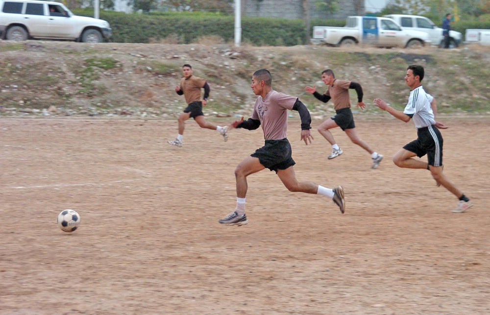 William Reynoso drives toward the Iraqi Police goal