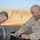 Sgt Shultz and SSgt. Lamothe fix a generator outside