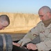 Sgt Shultz and SSgt. Lamothe fix a generator outside