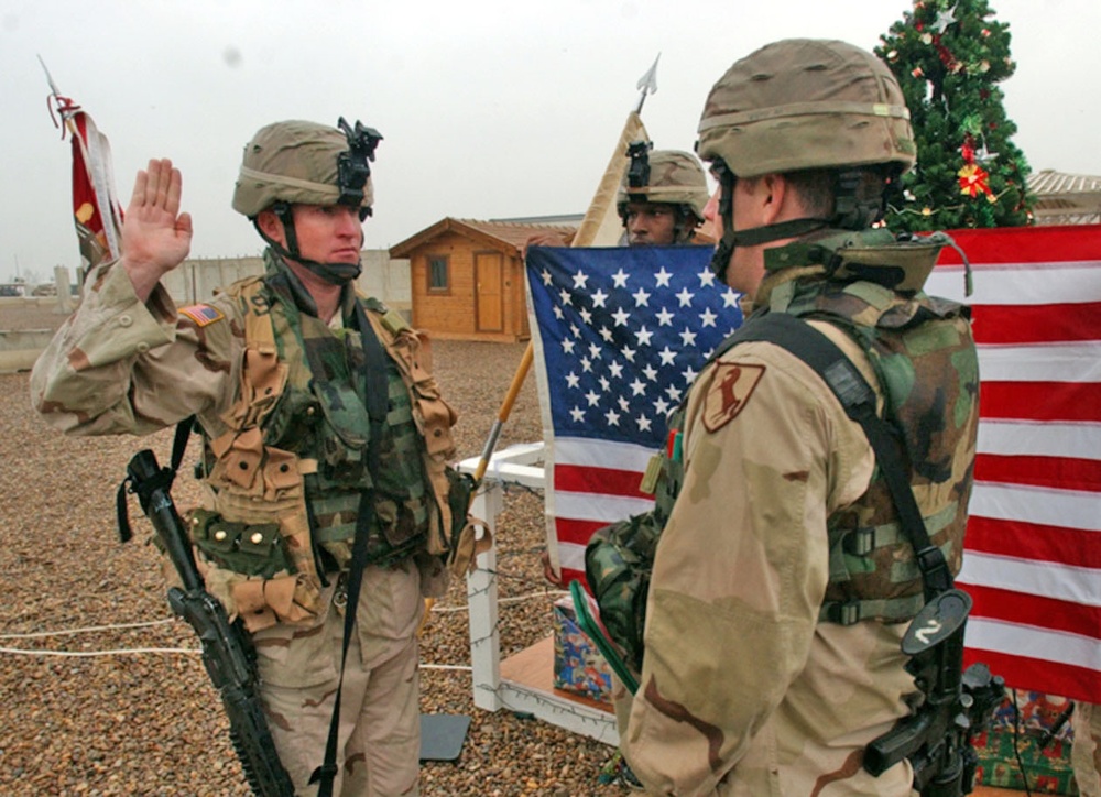 SSgt. Andrew Burt takes his oath of reenlistment