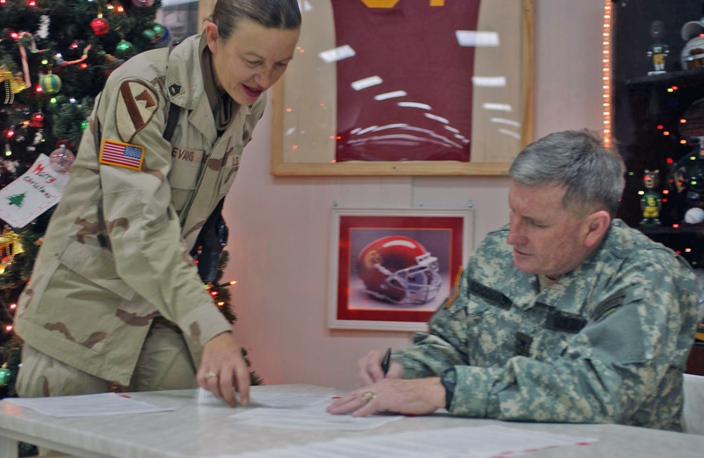 MSgt. Joni Evans assists Gen. Peter J. Schoomaker