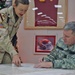 MSgt. Joni Evans assists Gen. Peter J. Schoomaker