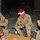 Pfc. Eric Bryan shows his Christmas spirit