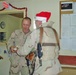 1st Sgt. Harvey presents one of his Soldiers with a meal