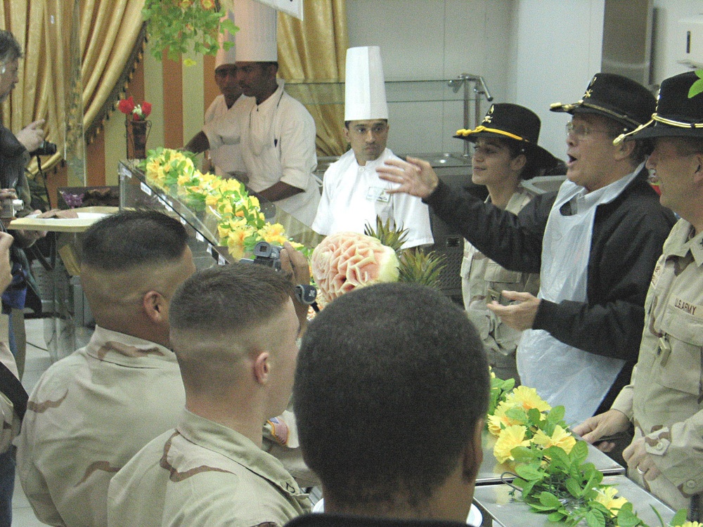Secretary of Defense serve Christmas Eve chow to Soldiers