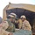 SGT Church helps load the lunch meal onto a truck with Spc. Char