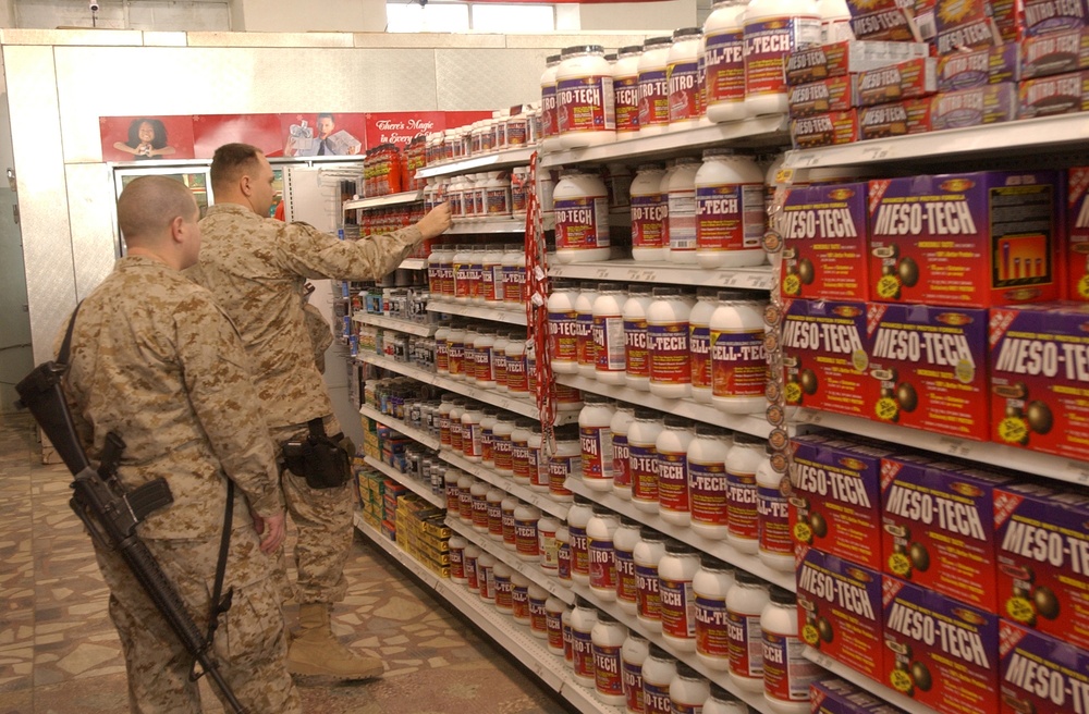 Soldiers look at supplements in the main PX/BX