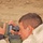 Spc. Hoyt, LRSD spotter, uses his spotter scope