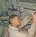 Sgt. Coco repairs the door of an up-armored HMMWV