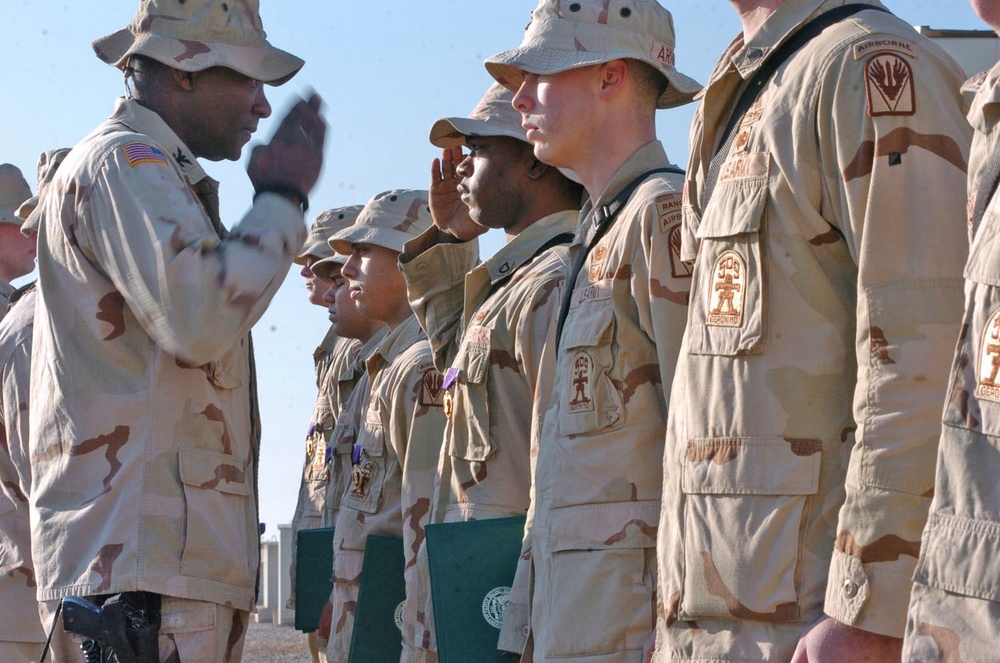 Pfc. Don Gavin salutes Col. John L. Smith