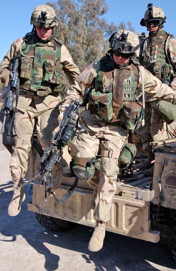 Soldiers dismount their vehicle to begin patrolling