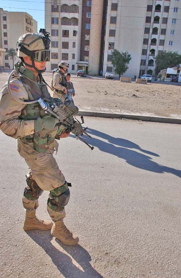 Soldiers patrol a Baghdad apartment complex