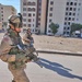 Soldiers patrol a Baghdad apartment complex