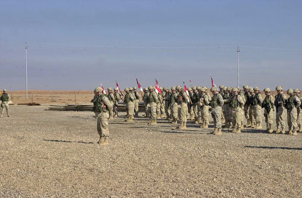 150th TOA bow their heads during the invocation