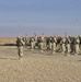 150th TOA bow their heads during the invocation