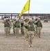 Soldiers salute during the national anthem