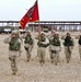 Soldiers salute during the national anthem