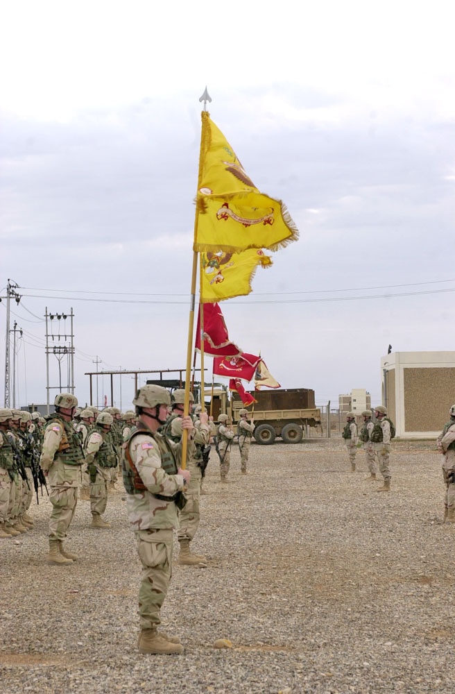 The guidon barrier raise their flags