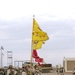 The guidon barrier raise their flags