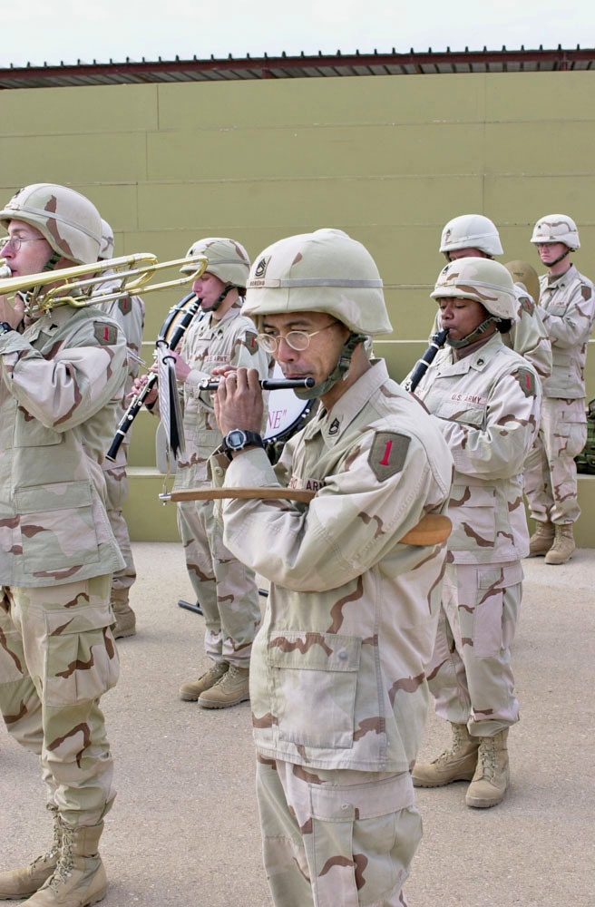 Sgt First Class Cristino Moreno plays the flute