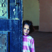 A shy little Iraqi girl peeks out