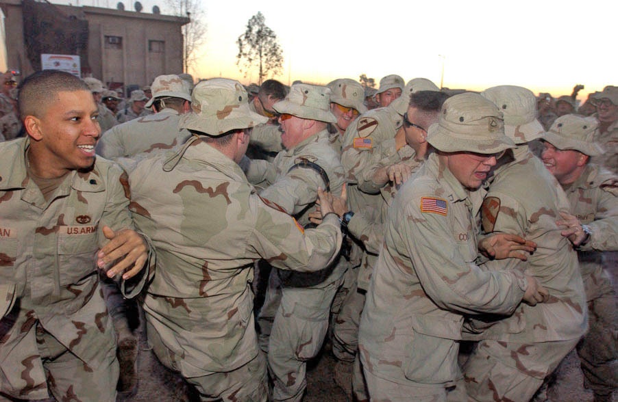 Soldiers let it all hang out in a mosh pit