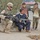 Spc. Robert Decelles kneel down during a patrol Spc. Robert Decelles kneel down during a patrol