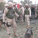 Working dog (Kim) sniff a 155-millimeter artillery