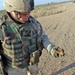 Maj. Paul Horlacher inspects a piece of shrapnel found