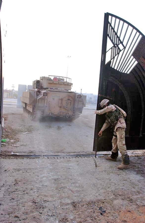 Sgt. David Frost closes the gate to the palace